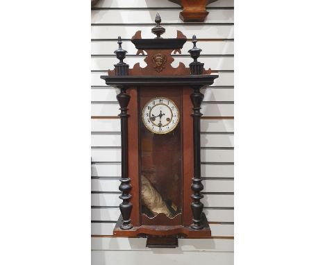 Small Vienna regulator-type clock in carved decorated case, the white enamel dial with Arabic numerals, half-hour striking me