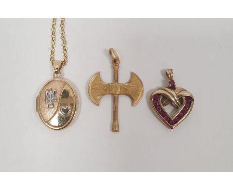 Gold-coloured metal double-headed battle axe pendant on fine gold chain, a gold red stone set heart pendant and a gold-colour