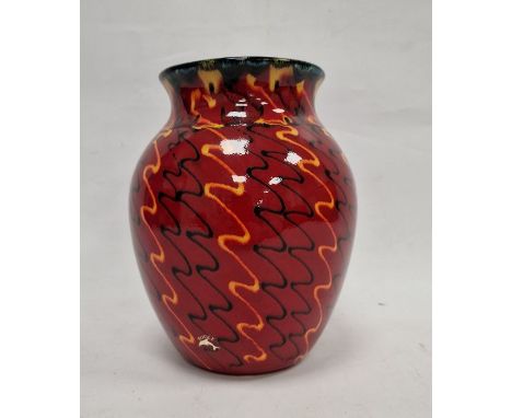 Modern Poole pottery vase with everted rim, ovoid body, the red ground decorated with black and orange wavy lines, 24cm high 