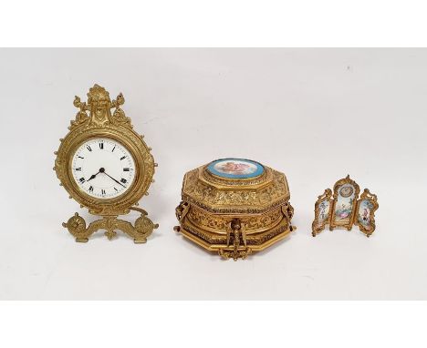 French gilt metal jewellery box, the top with oval ceramic plaque featuring cherub on pagoda top with scrolling leaf decorati