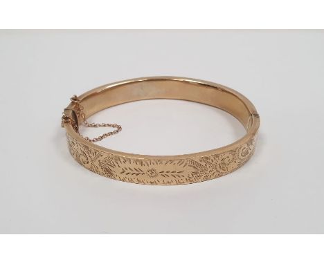 9ct gold bangle with engraved decoration, 12.5g approx. (several dents)
