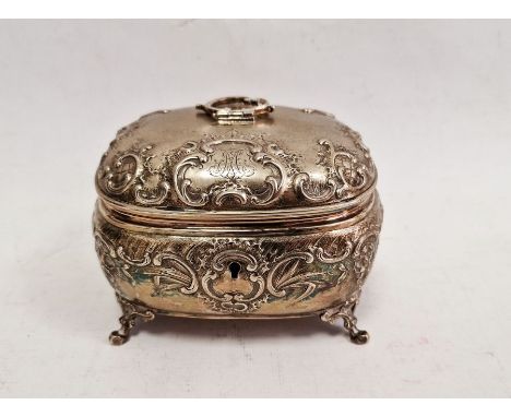 19th century continental silver-coloured bombe shaped tea caddy, indistinctly hallmarked to gilt interior, cast with rocaille