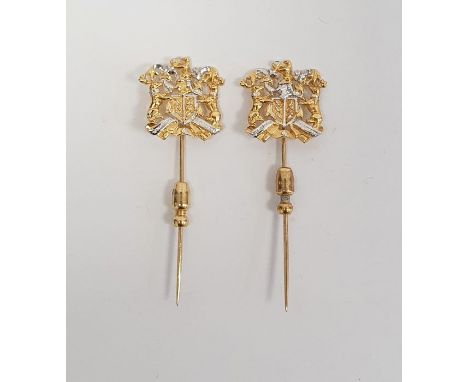 Pair of identical 18ct yellow and white gold hat/tie pins, bearing a coat of arms, stamped 750, 7.7g