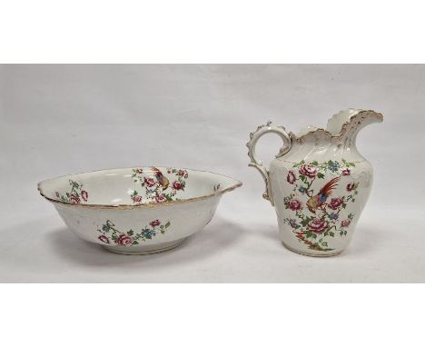 Staffordshire pottery ewer and basin decorated with exotic bird and rose branches