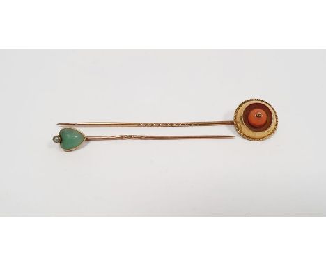 Gold and coral stickpin set single coral within circular surround and fine ropetwist border and a gold and jade stickpin, hea
