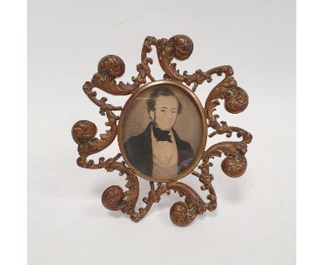 Nineteenth century miniature on paper, half-length portrait of Victorian gentleman in black cravat, in ornate gilt scroll fra