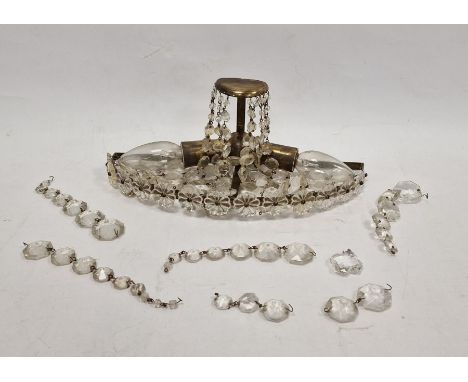 Early 20th century brass wall light with cut glass drops.