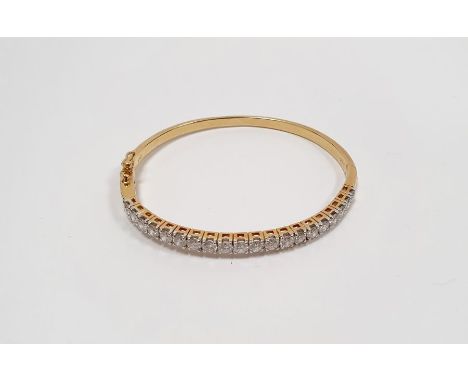 18ct gold bangle set with 20 diamonds, stamped 750, approx. 15g Condition ReportInside diameter approx 5.3cmCentral diamond d