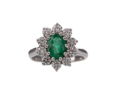 CERTIFICATED EMERALD AND DIAMOND RING,set with an oval emerald of approximately 1.40 carats, with evidence of oiling, within 