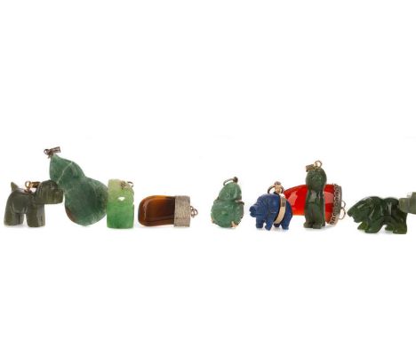 COLLECTION OF HARDSTONE PENDANTS,mainly jade, along with two lapis lazuli pigs, a carnelian and a tigers eye example, along w