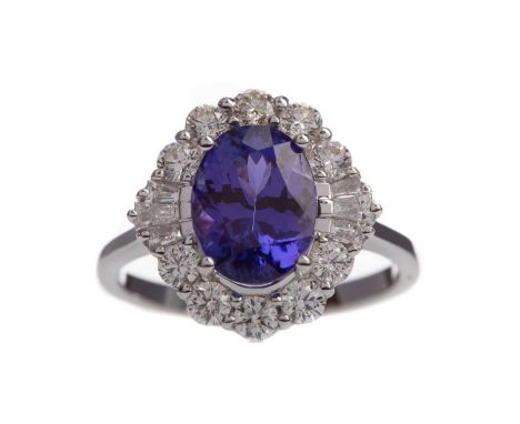 CERTIFICATED TANZANITE AND DIAMOND RING,set with an oval tanzanite of approximately 3.43 carats within a halo of round brilli