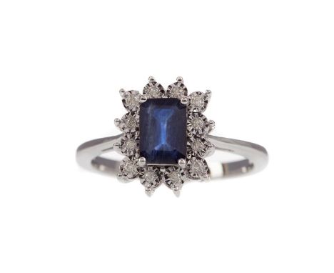 SAPPHIRE AND DIAMOND RING,the emerald cut sapphire of approximately 1.05 carats within an illusion set round brilliant cut di