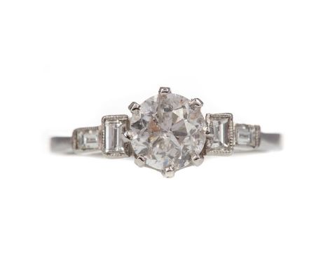 DIAMOND DRESS RING,set with a round brilliant cut diamond of approximately 1.07 carats, flanked by two baguette cut diamonds 