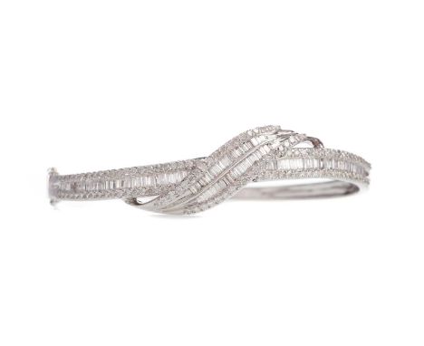 DIAMOND BANGLE,set with round brilliant and baguette cut diamonds totalling approximately 2.17 carats, in eighteen carat whit