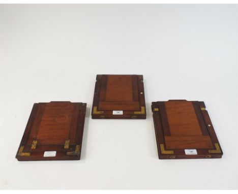 A set of three mahogany bellows camera double dark slidesPlate size 6.5x8.5", outer dimensions 27cm x 21cm