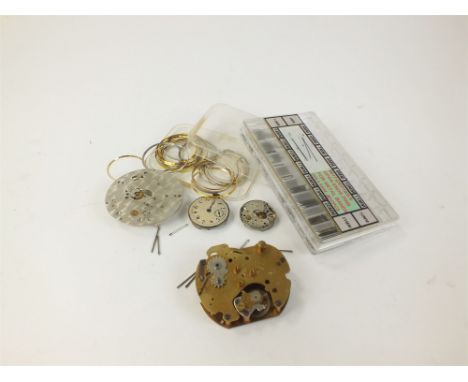 A large collection of movements, dials, various duplicate watch parts and tools, together with crystals etc (a lot)