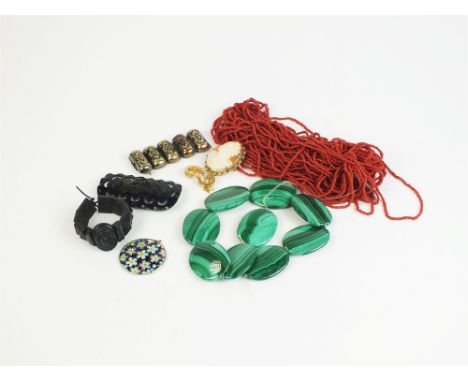 A large collection of various pieces of costume jewellery, to include; stick coral, malachite panels, cameos, hat pins, a yel