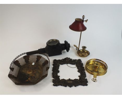 A collection of metal wares 19th/20th century including a toleware basket, 33cm, a brass chamber stick, a brass student chamb