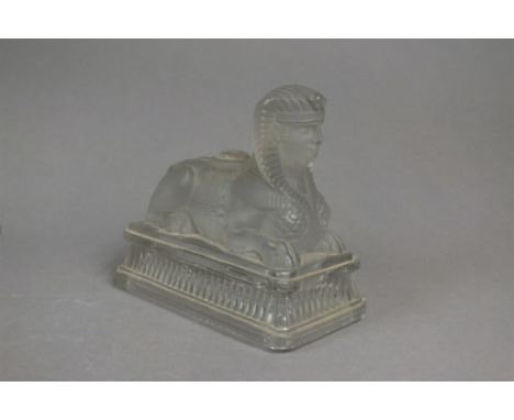 A rare French Saint Louis Egyptian Revival frosted glass paperweight in the form of a Sphinx, circa 1876-8, with moulded fact