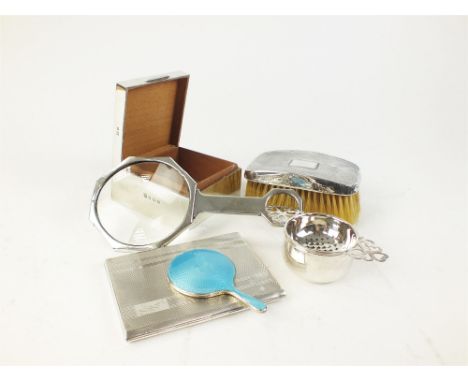 A collection of silver, to include, an engine turned cigarette case, two silver backed brushes, a silver mounted cigarette bo