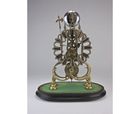 A brass skeleton clock with triple steeple open frame and single fusee movement striking on a bell with axe head hammer silve