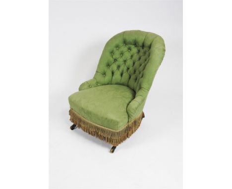 A Victorian nursing chair later upholstered in green floral damask with button back seat and raised on turned walnut legs and