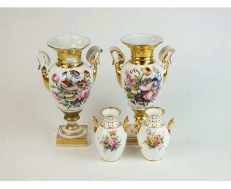 A pair of Paris porcelain vases, late 19th century, of twin-handled figural bird form with central panelled decoration of flo