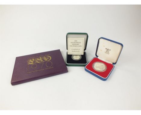 A collection of commemorative silver proof coins, 1970 and 1990 year sets, together with a silver necklace and bracelet, a br