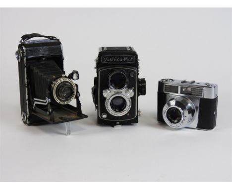 A collection of cameras and accessories to include aYashica-Mat Copal-MXV double lens camera and case Zeiss Ikon Symbolica, Z