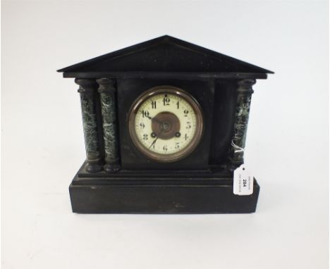 Two black and variegated marble mantel clocks circa 1890-1900, the first of architectural form with pediment supported by gre