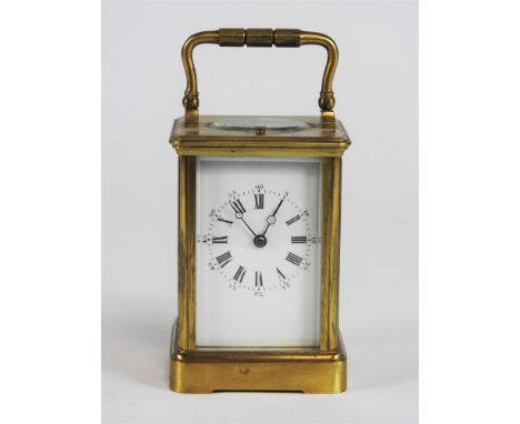 A brass carriage clock with repeating movement, Roman numerals, white dial, 8-day movement striking on a single gong, 11cm hi