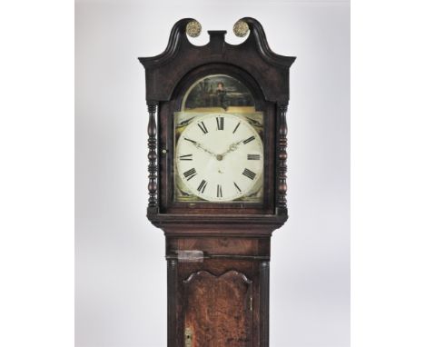 A George III crossbanded oak boxwood and ebony strung longcase clock, the broken scroll swan neck pediment above an arched gl