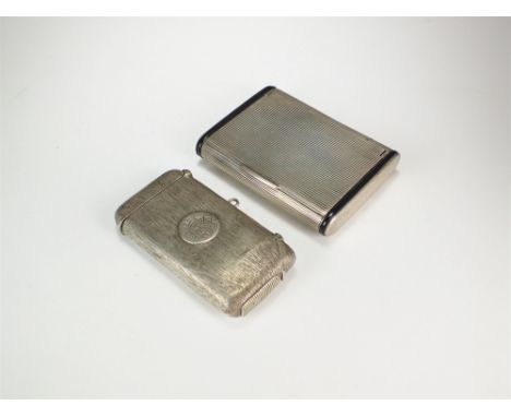 An Edwardian silver combined cigarette and vesta case, A J Zimmerman, Birmingham 1901, together with a white metal and black 