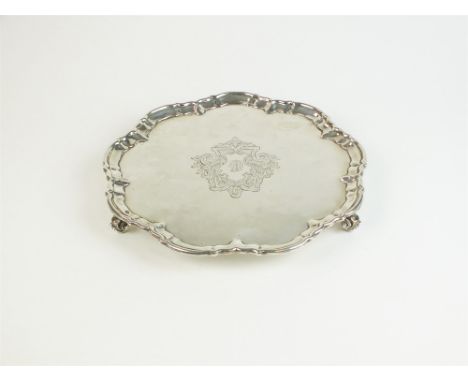 A silver salver, William Hutton &amp; Sons Ltd, London 1904, of shaped circular form with engraved crest to the centre, raise