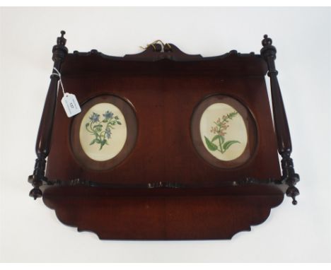 A George III style mahogany mural shelf Of fret-back form inset with twin oval frames containing botanical prints, the two sh