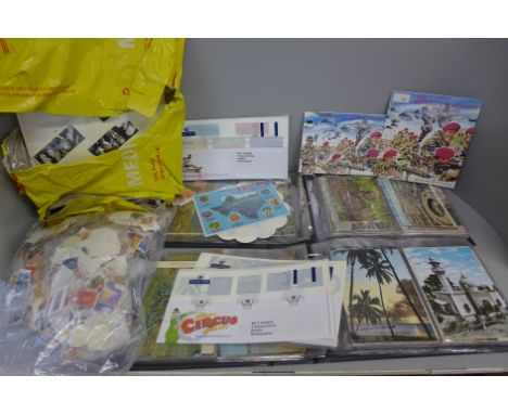 Two albums of postcards, 1970s/80s, a collection of loose stamps, first day covers, etc. 