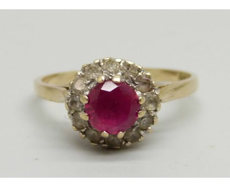 A 9ct gold ring set with a ruby and white stones, 2.3g, N 