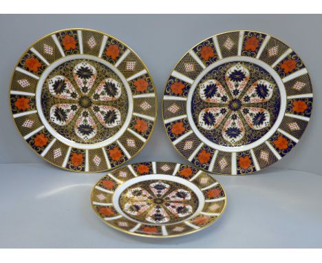 A pair of Royal Crown Derby Old Imari pattern plates and a medium side plate 