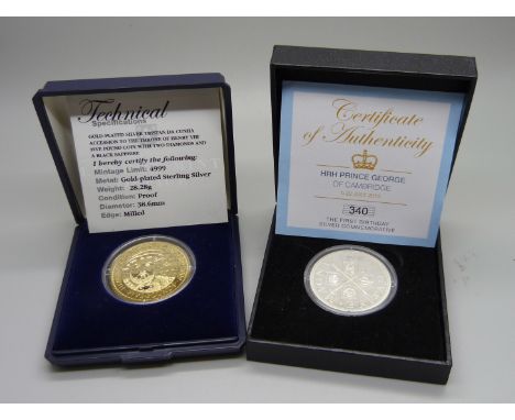 Two silver coins; HRH Prince George of Cambridge first birthday commemorative coin and a gold plated Henry VIII five pound co