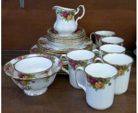 A collection of Royal Albert Old Country Roses china including five saucers, six mugs, sugar bowl, milk jug, a larger bowl, s