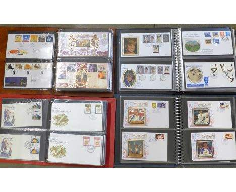Four albums of first day covers 