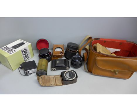 A collection of camera lenses and light meters 