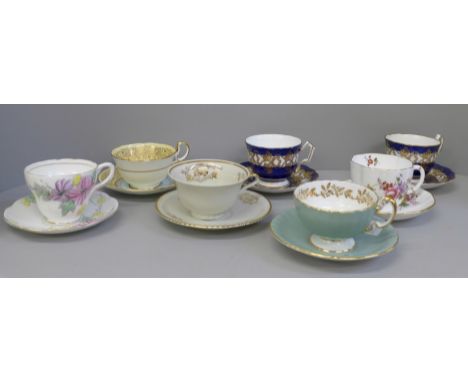 Seven cups and saucers including four Aynsley 