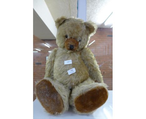 A large vintage Teddy bear with growler 