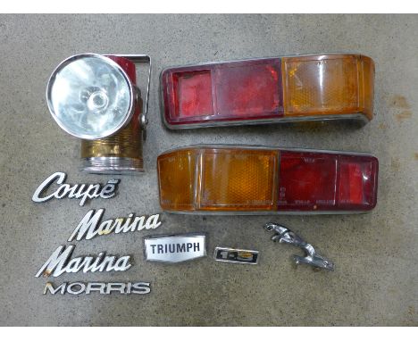 A box of car parts including a Jaguar mascot, light clusters and a Pifco torch 