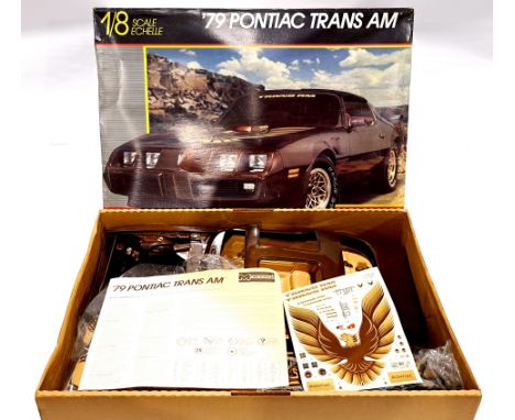 Monogram 2611 '79 Pontiac Trans AM 1:8 scale unmade plastic model kit. Condition generally appears to be Good Plus, contents 