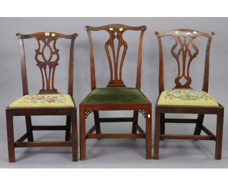 Three Chippendale-style splat-back dining chairs each with a padded drop-in-seat, &amp; on square legs with plain stretchers.