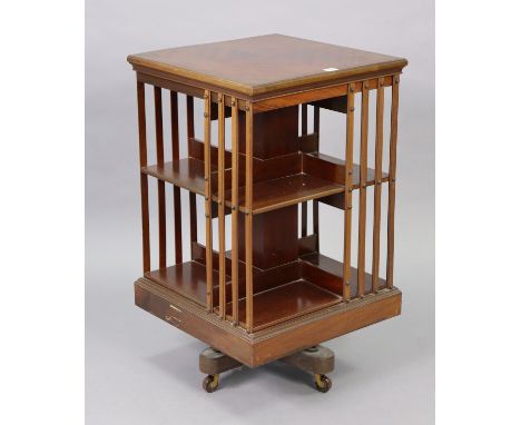 An Edwardian mahogany square three-tier revolving bookcase on ceramic castors, 19¼” wide x 33¼” high. 