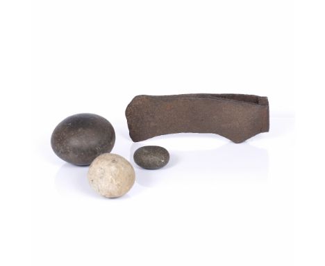 A GROUP OF BRITISH ANTIQUITIES including three hammer stones and an iron battle axe, pre-medieval