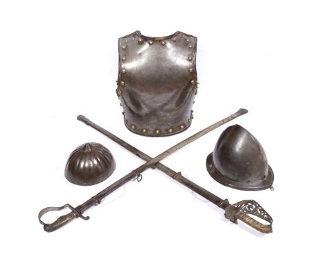 AN ANTIQUE STEEL BREAST PLATE with brass studs and leather trimmed rim, 41cm high, a Saxon style Spangelhelm (lacking chain m